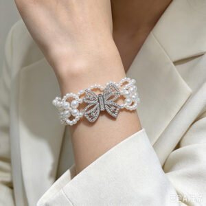 Multi-layered braided pearl bracelet with diamond butterfly clasp - elegant